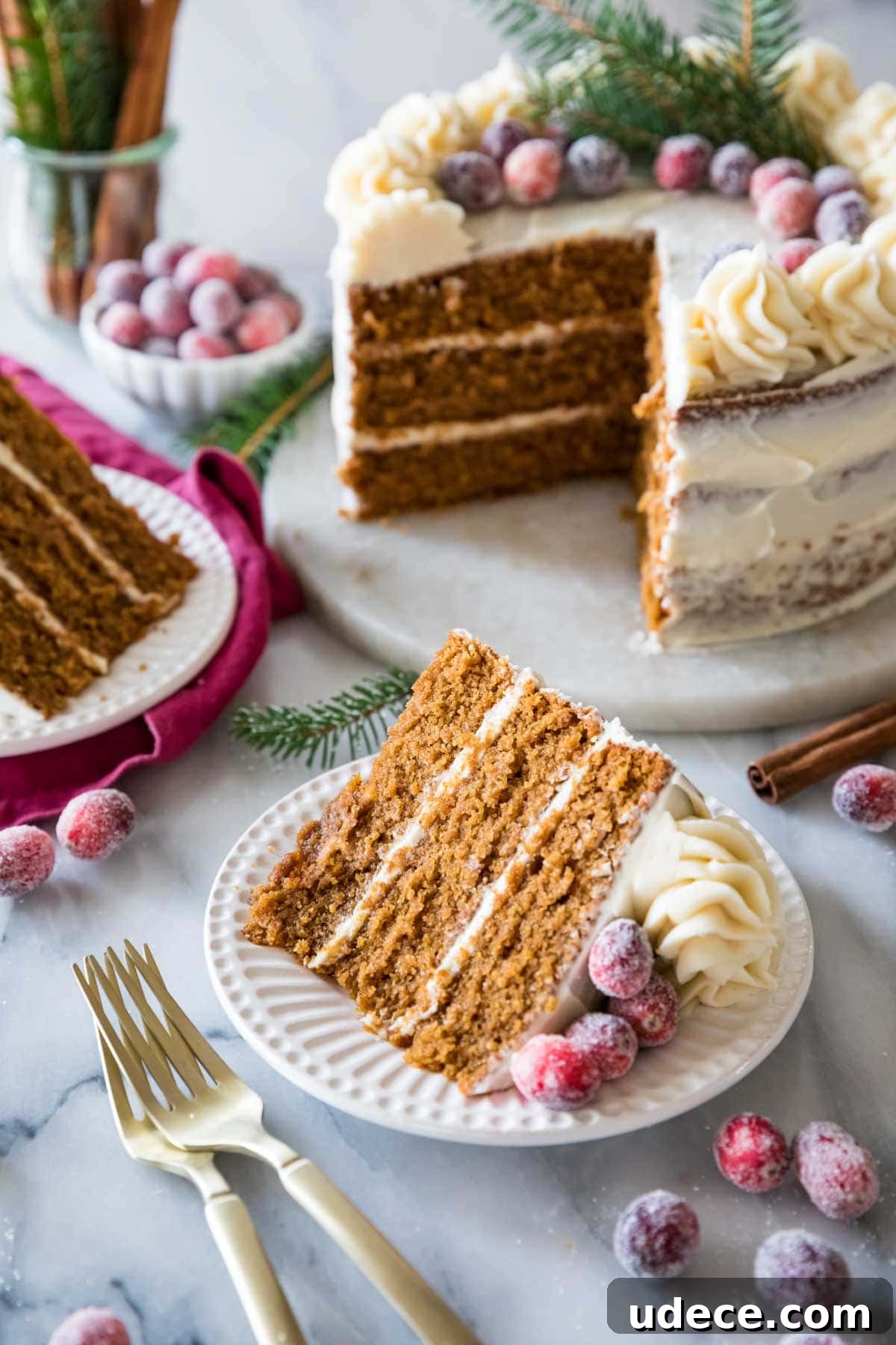 Gingerbread Layer Cake Recipe with Spiced Cream Cheese Frosting 7 Two slices of cake cut from a three layer gingerbread cake.