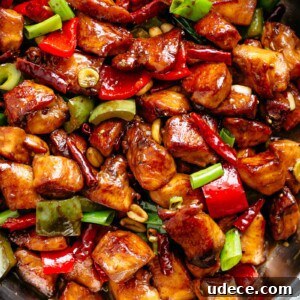 Kung Pao Chicken is highly addictive stir-fried chicken with the perfect combination of salty, sweet and spicy flavour! Make it better than Chinese take out right at home! With crisp-tender chicken pieces and some crunchy veggies thrown in, this is one Kung Pao chicken recipe hard to pass up