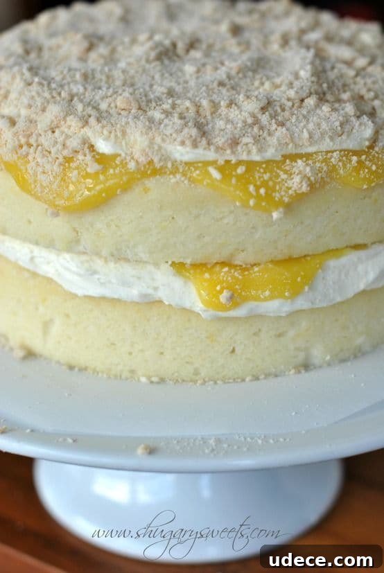 50 Zesty Citrus Desserts: Bright Recipes for Every Occasion 24 Lemon Cake with Creamy Filling and Lemon Curd