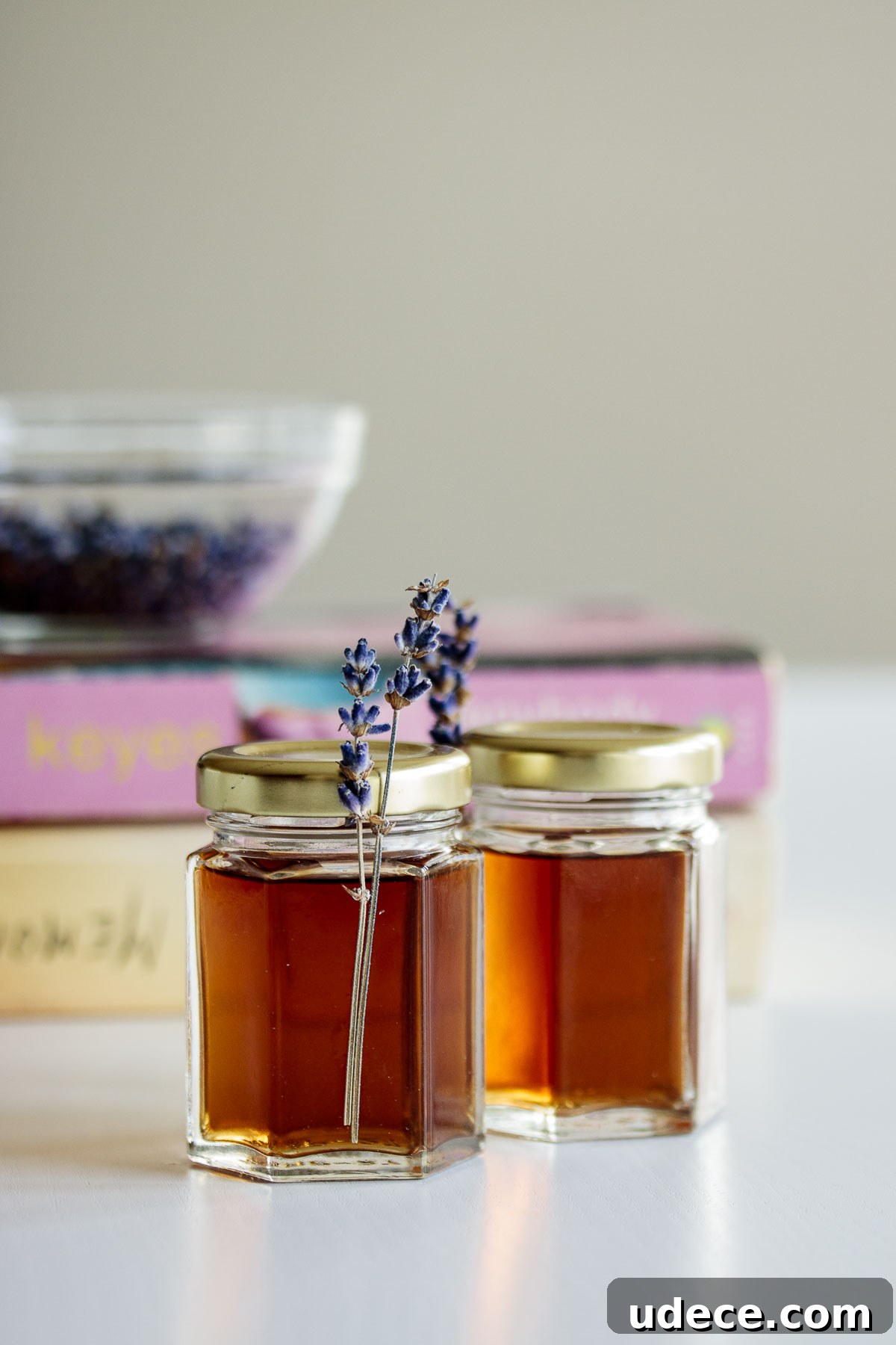 Homemade Lavender Extract for Baking and Cocktails 2 Two bottles of lavender extract with lavender flowers.