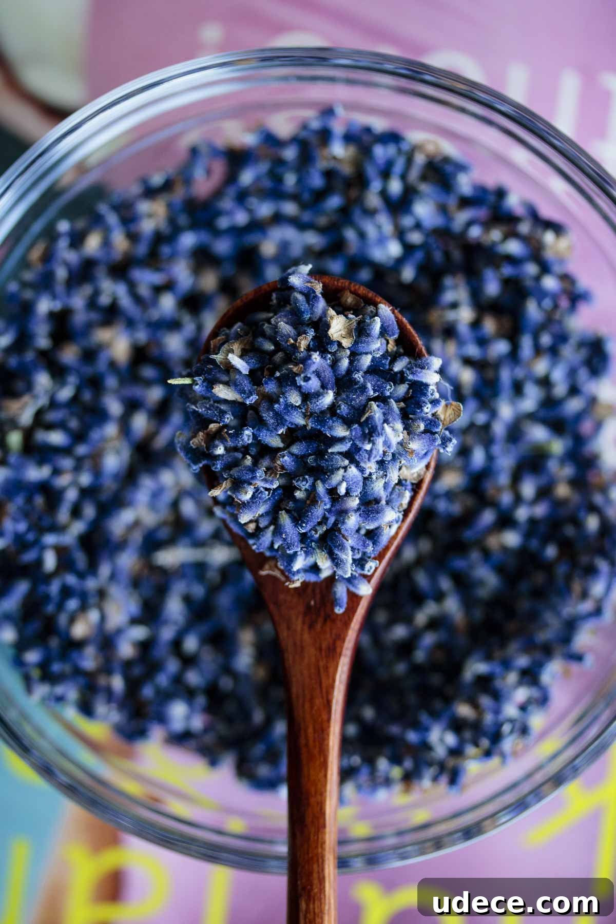 Homemade Lavender Extract for Baking and Cocktails 3 Fresh lavender on a wooden spoon.