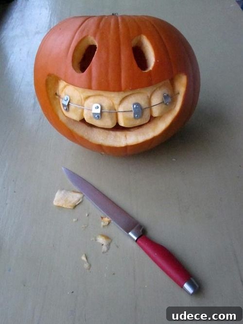 25+ Creative Pumpkin Carving Ideas for Halloween Decorations 15 Smiley Braces Carved Pumpkin | 25+ Creative Carved Pumpkins