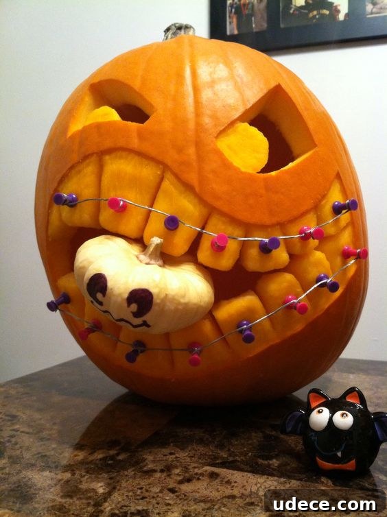 25+ Creative Pumpkin Carving Ideas for Halloween Decorations 4 Braces and Baby Carved Pumpkin | 25+ Creative Carved Pumpkins