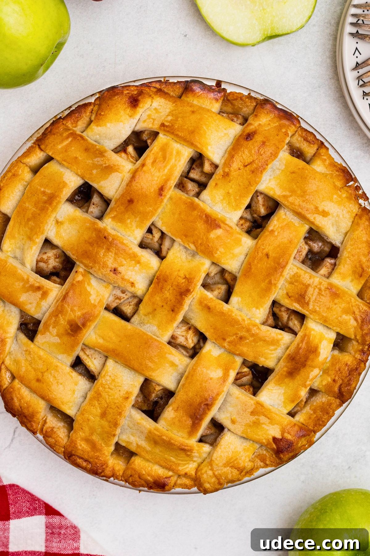 Classic Homemade Apple Pie Recipe for Perfect Crust and Filling 9 Golden baked apple pie on a white marble table.
