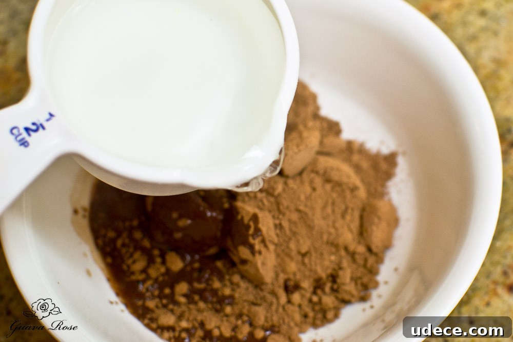 Pouring hot water into cocoa