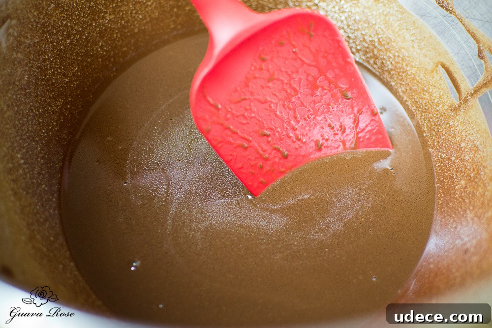 Mixing cocoa+hot water with butter and oil