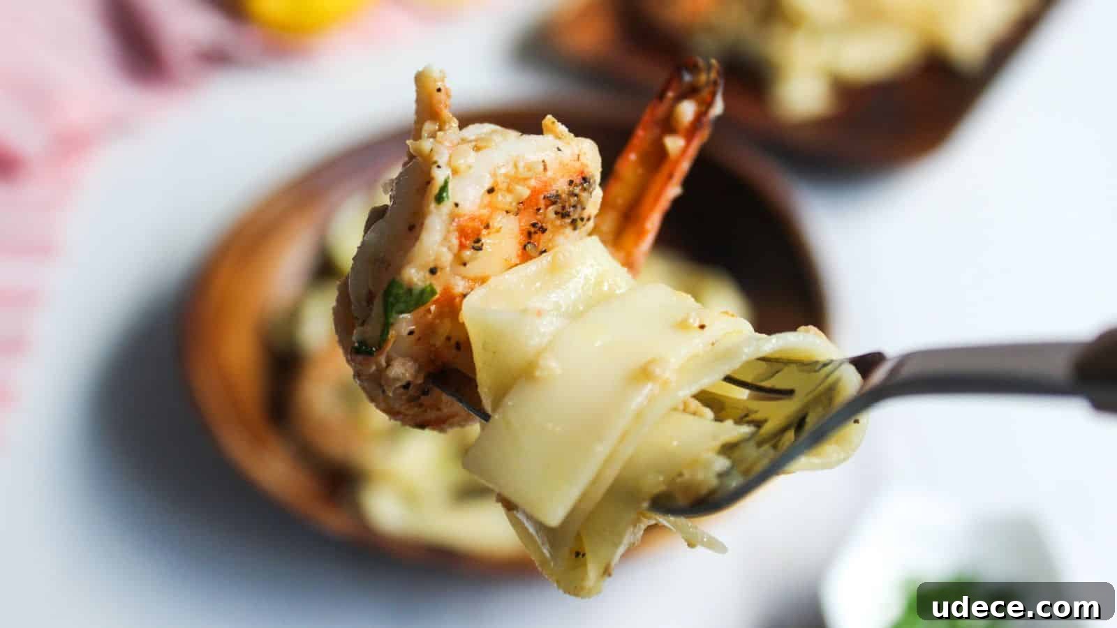 28 Seafood Dinners for Two That Deliver Restaurant-Quality Flavor 11 Fork lifting a shrimp and pasta dish, with more food in the background.