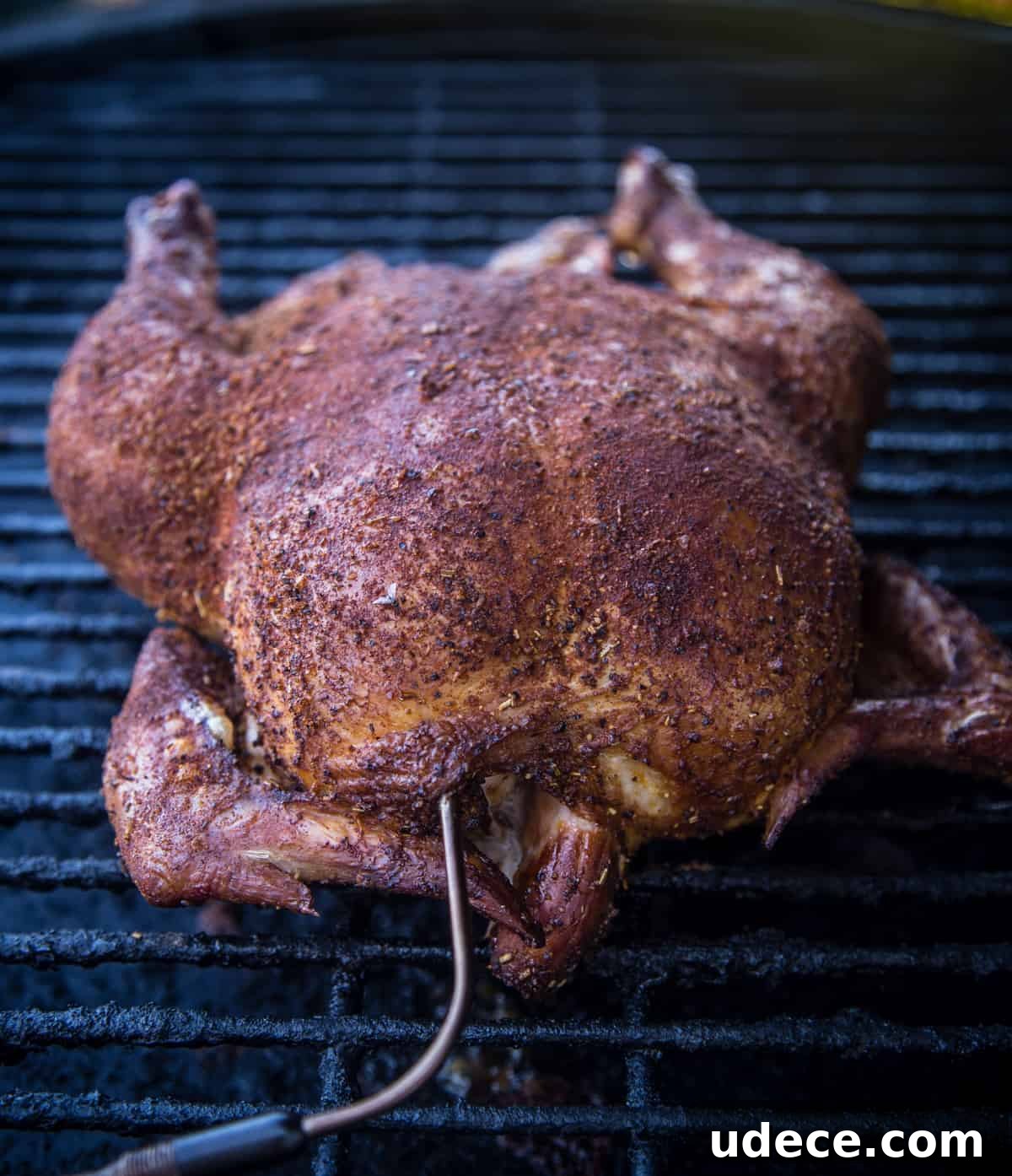 Smoked Chicken Chili Recipe: Hearty Texas-Style Slow-Smoked Chili 3 A whole chicken cooking on a smoker