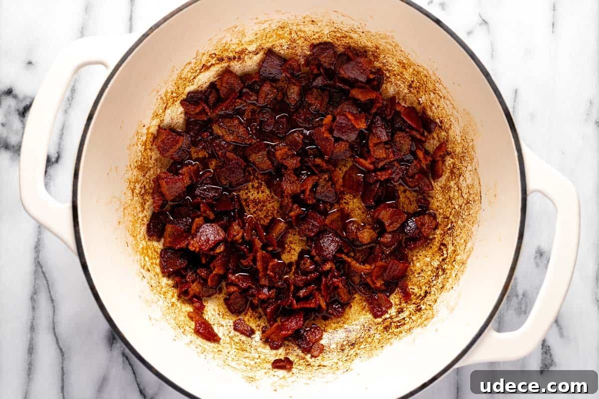 Large pot with crispy cooked bacon. 