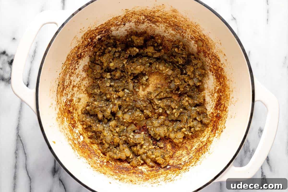 Sauteed onion, garlic, dried herbs, and flour in a large pot. 