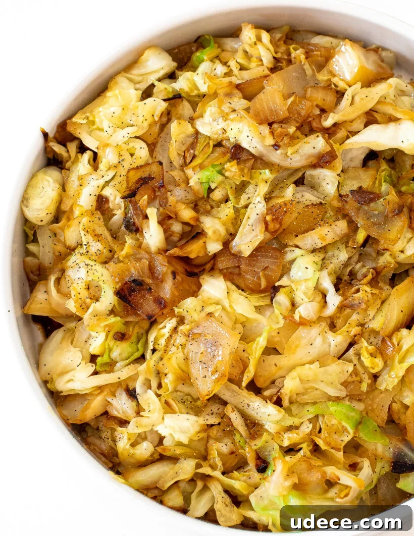 Garlic Butter Sautéed Cabbage Recipe for Quick Weeknight Sides 2 Overhead shot of sauteed cabbage served in a white bowl.
