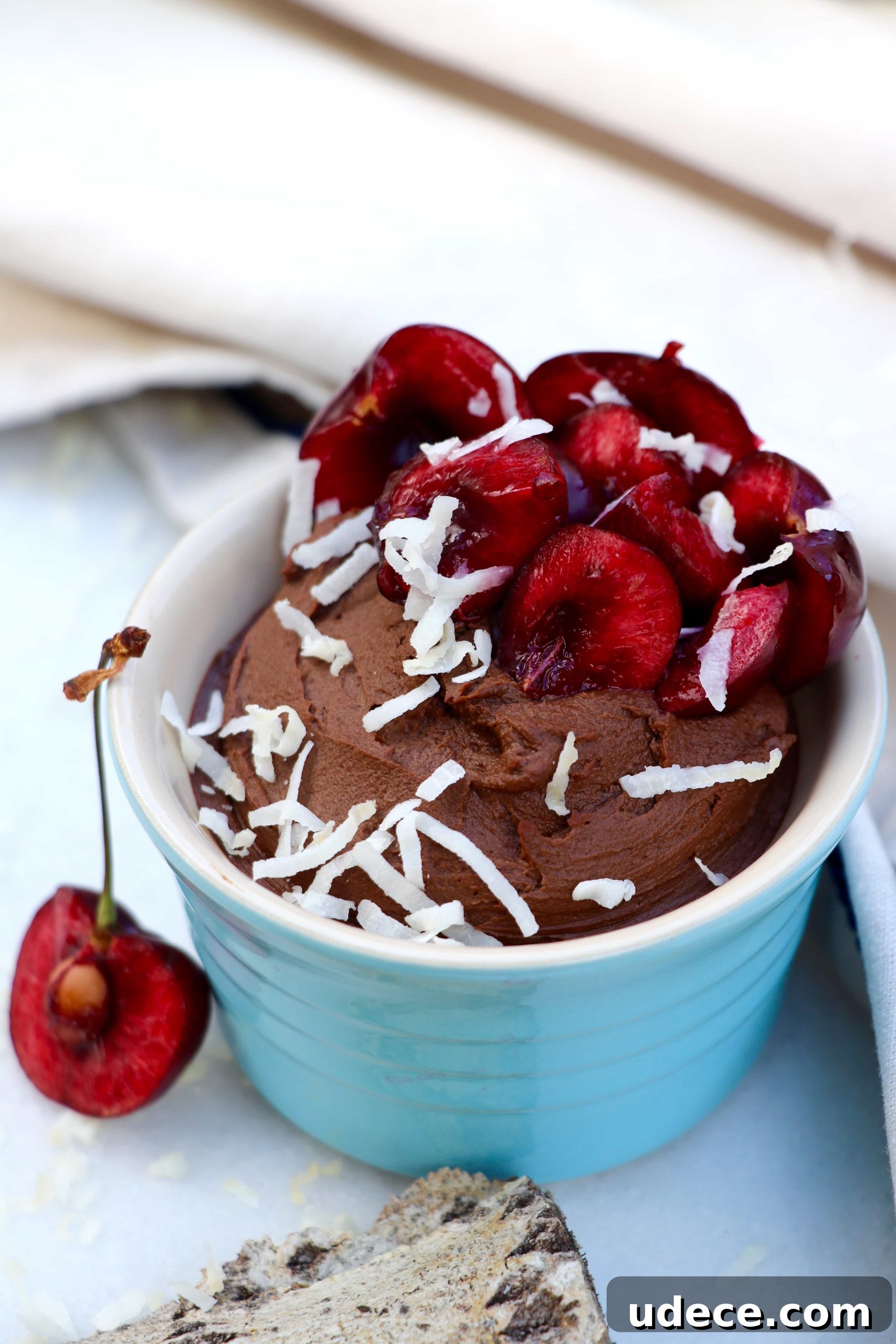 Two ramekins of avocado chocolate mousse