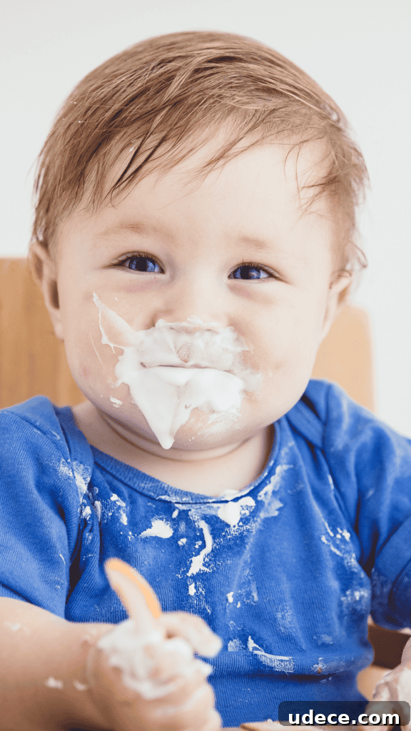 Heavy Metals in Baby Food: Risks, Limits, and Safe Choices 2 Little Boy Feeding Himself Yogurt with Messy Face and Shirt