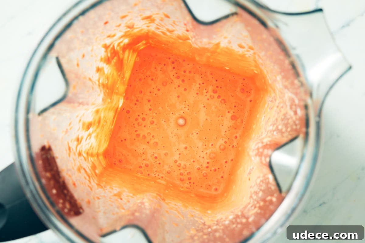 Smoky Roasted Red Pepper Crema Recipe 8 Roasted red pepper crema in a blender after blending.