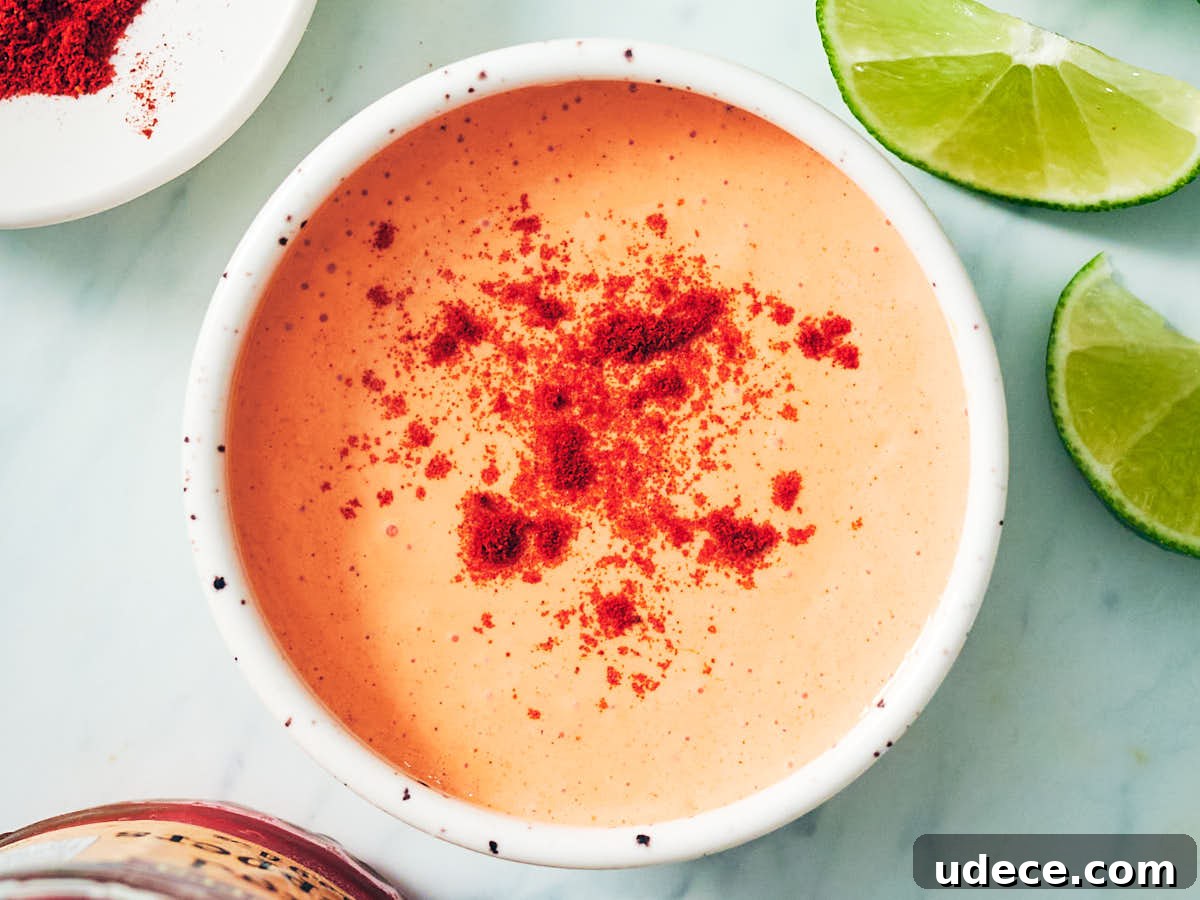 Smoky Roasted Red Pepper Crema Recipe 9 Smoky Red Pepper Crema in a bowl topped with smoked paprika.