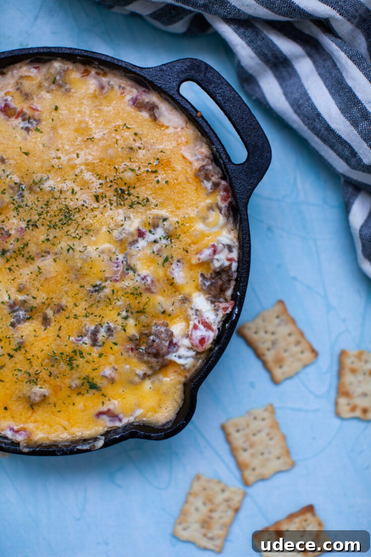 Creamy Skillet Sausage Dip Recipe for Game Day and Parties 5 crackers with skillet sausage dip