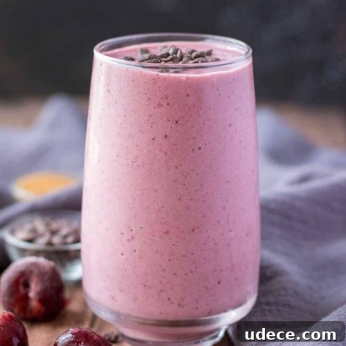 Cherry Banana Smoothie served in a glass topped with chocolate