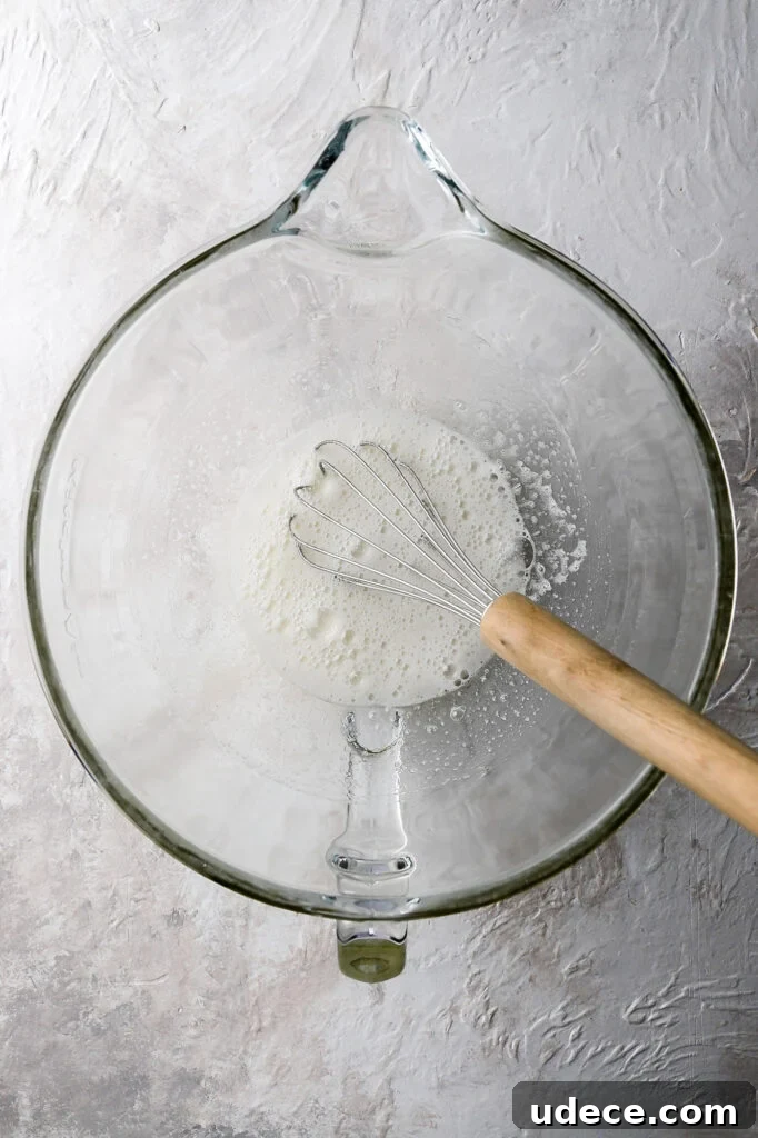 cooked egg whites and sugar looking frothy