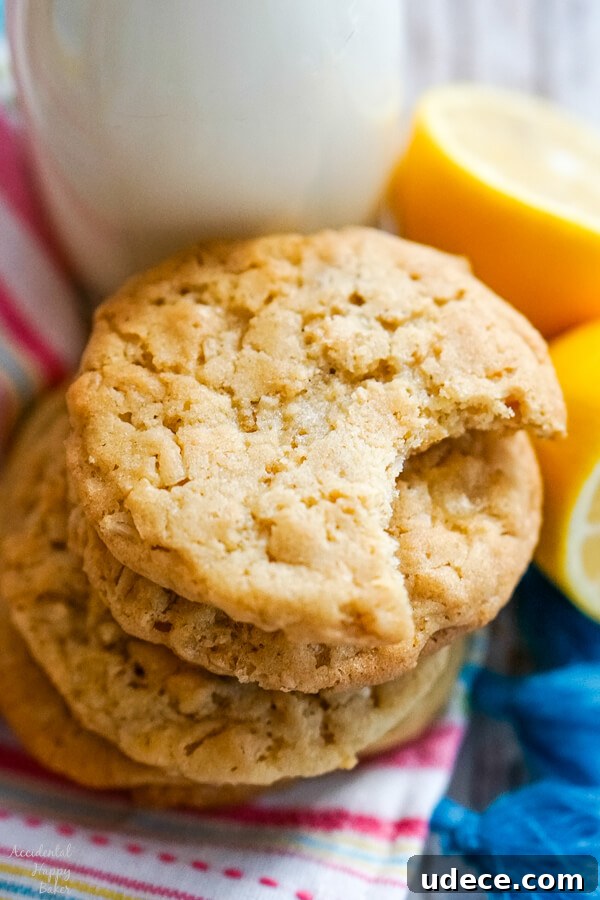 Zesty Lemon Cowboy Cookies Recipe for Soft, Chewy Treats 2 A stack of lemon cowboy cookies next to a bottle of milk.