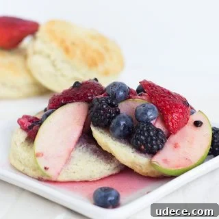 A plate of Redd's Apple Fruit Shortcake biscuits with berries on it.