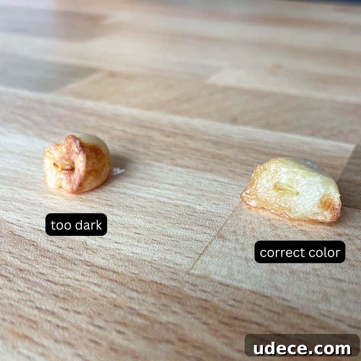 How to Roast Garlic Perfectly for Rich, Sweet Flavor 9 Two cloves of garlic are shown; one is dark brown and labeled "too dark", and the other is golden brown and labeled "correct color."