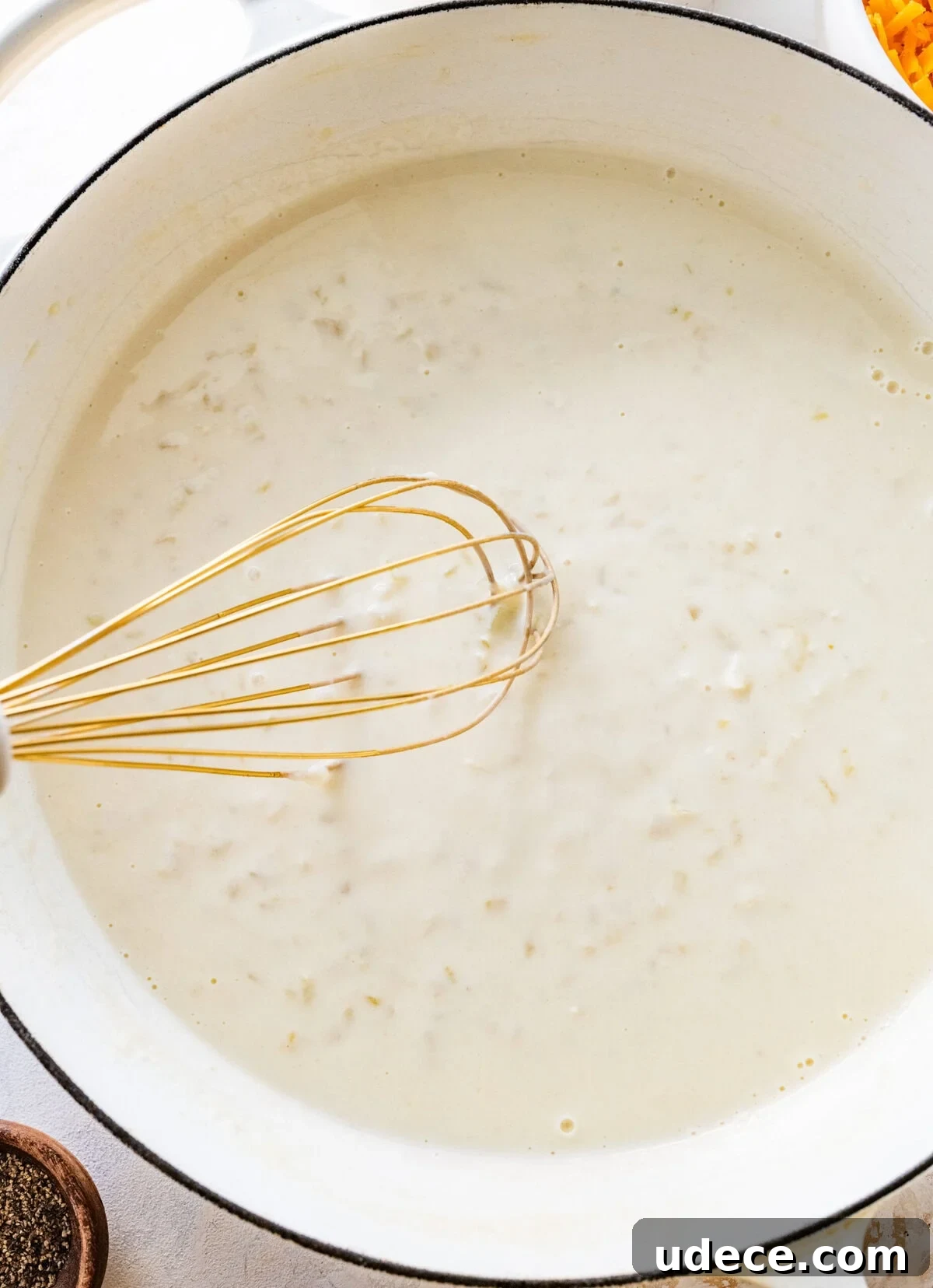 Classic Funeral Potatoes Recipe for Parties and Potlucks 8 The roux for the party potatoes in a pot.
