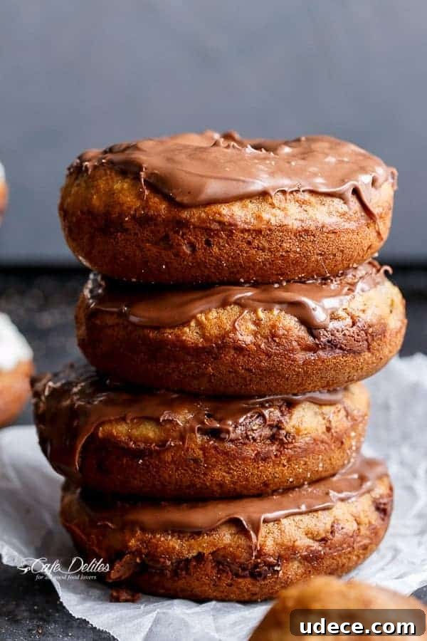 Baked Banana Donuts Recipe — Moist Homemade Banana Bread Donuts 2 A stack of Nutella topped donuts on each other