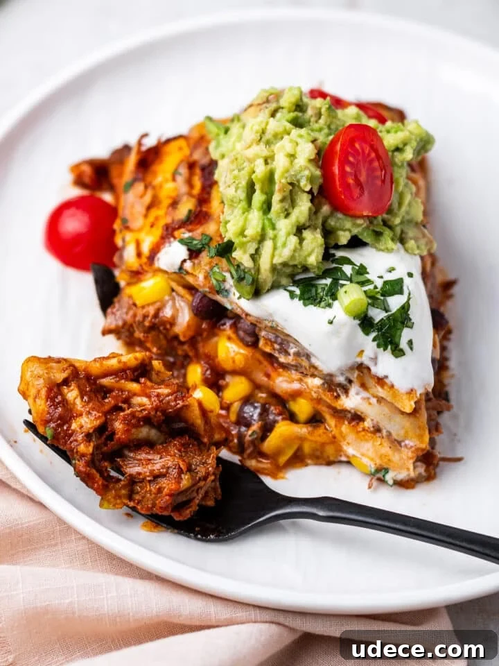 Cheesy Beef Enchilada Pie Recipe for Dinner Crowd-Pleasers 17 bite of enchiladas on a fork