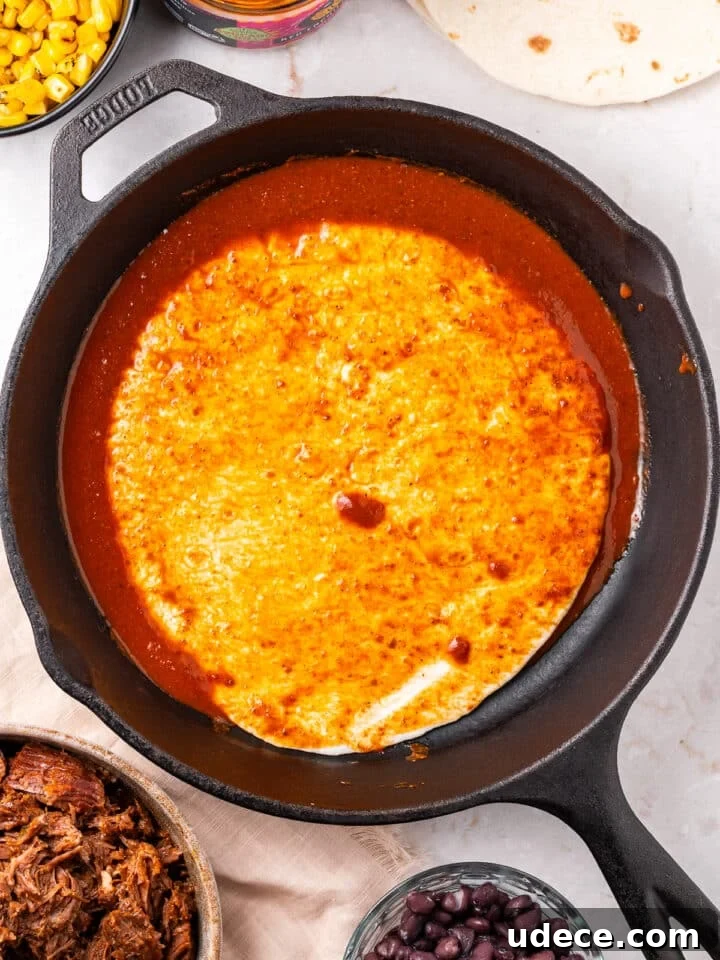 Cheesy Beef Enchilada Pie Recipe for Dinner Crowd-Pleasers 5 tortilla in sauce