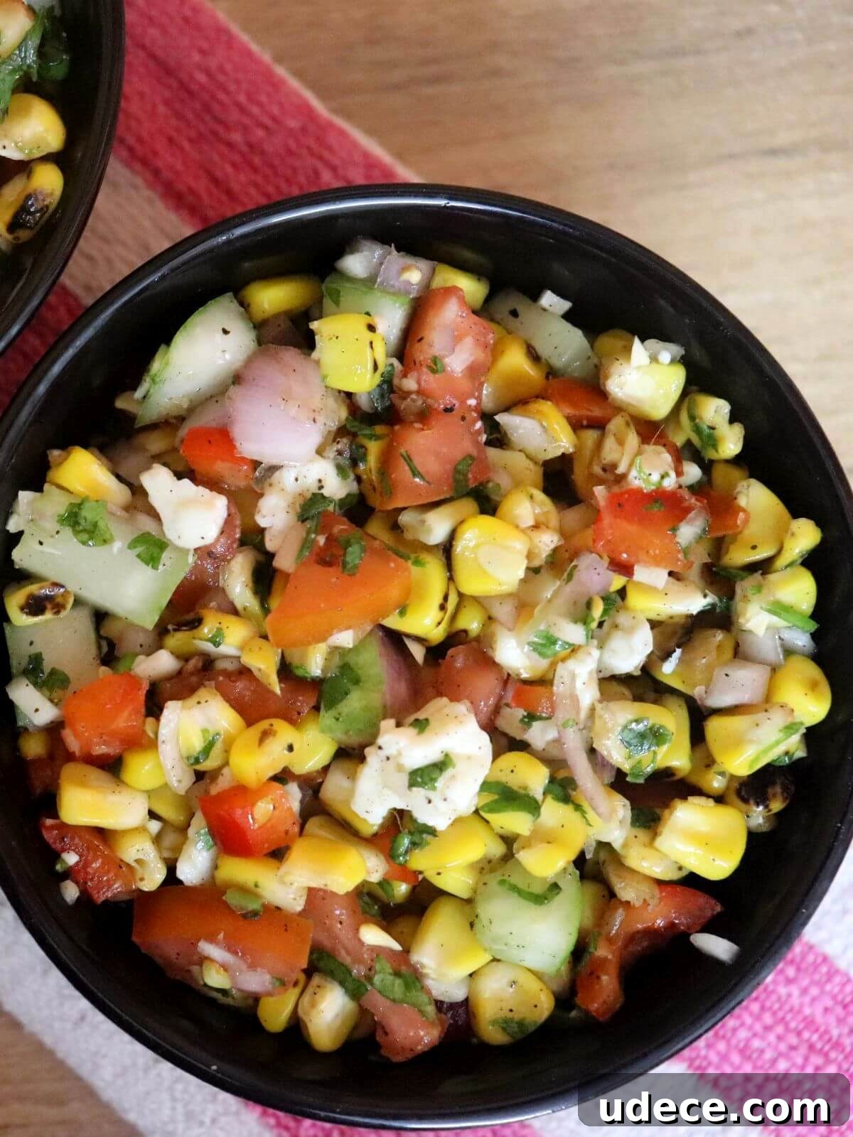 Grilled Corn and Feta Salad with Lime and Cilantro 2 top-view of grilled corn salad with feta cheese in a bowl.