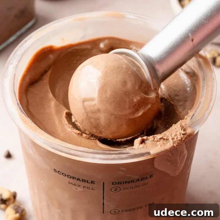 Rich Chocolate Ice Cream Recipe for Ninja Creami Machines 18 Scooping chocolate ice cream out of pint