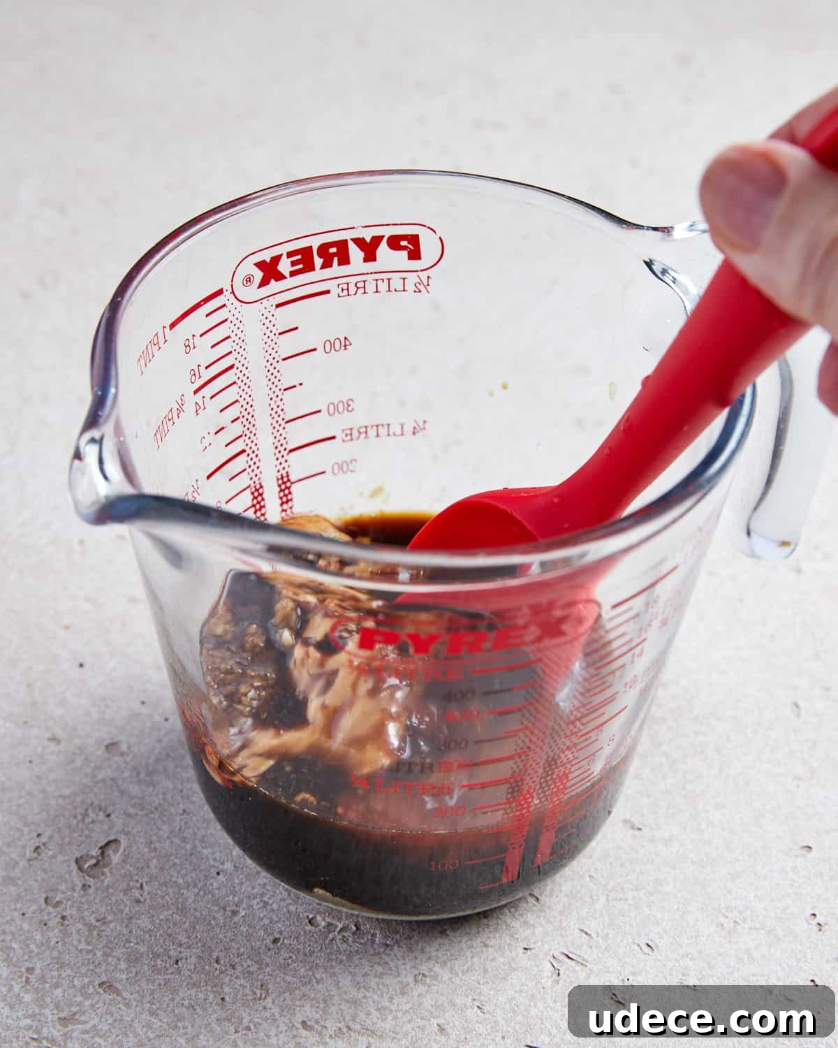 Photo showing ingredients being whisked together in a jug.