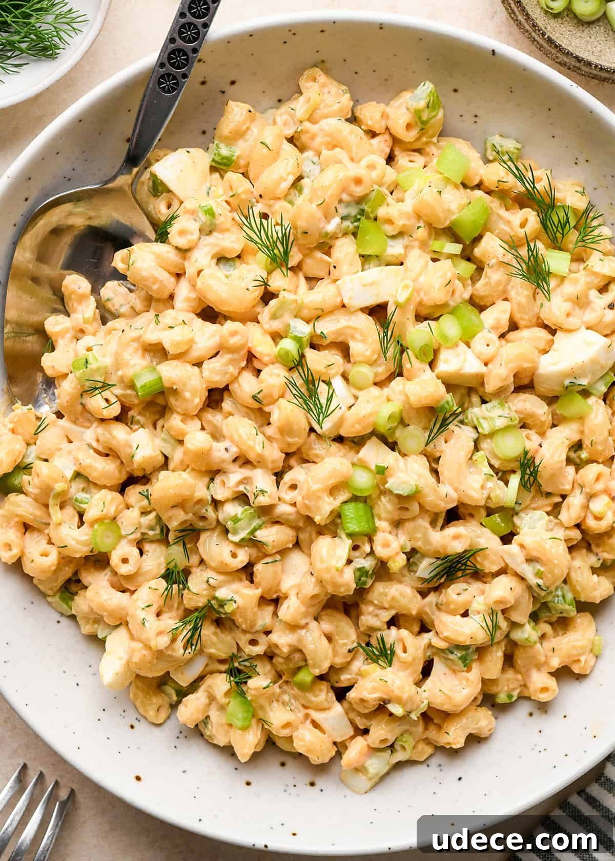 Classic Creamy Macaroni Salad Recipe 11 Macaroni Salad in a bowl with a spoon