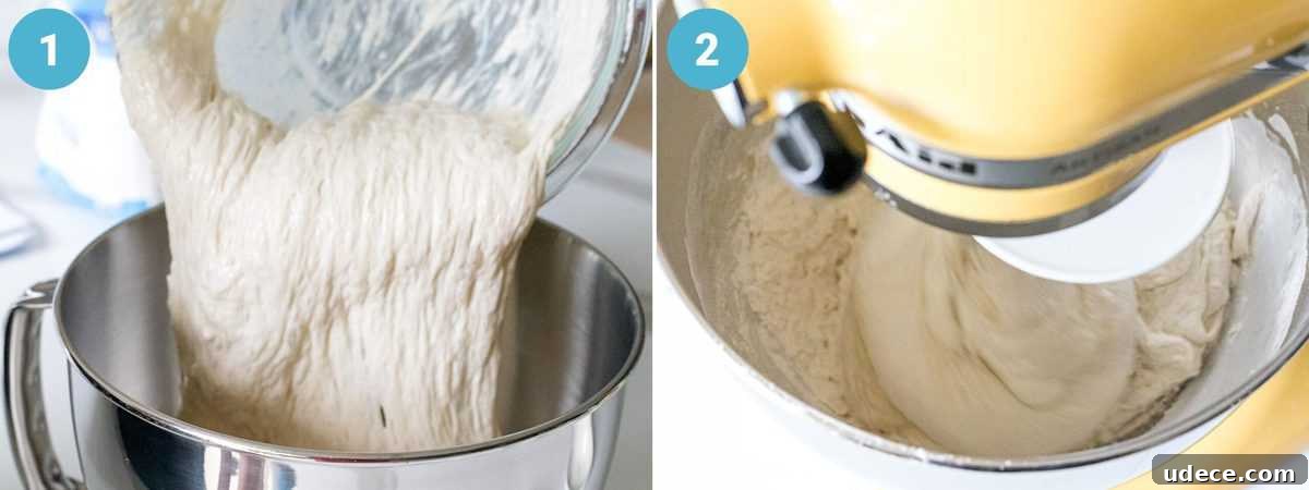 Sourdough starter and poolish being added to a large mixing bowl attached to a stand mixer with other ingredients to develop gluten.