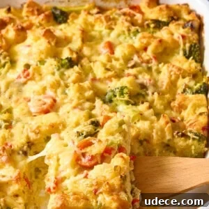 30+ Vegetarian Dinner Ideas That Make You Forget Meat Forever 7 A wooden spoon lifting a scoop of vegetarian breakfast casserole.
