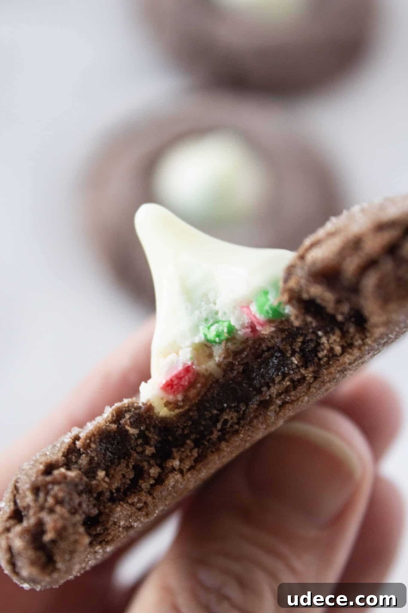Chewy Chocolate Kiss Cookies Recipe: Classic Chocolate-Studded Cookies 2 A Chocolate Kiss Cookie with a bite taken from it.