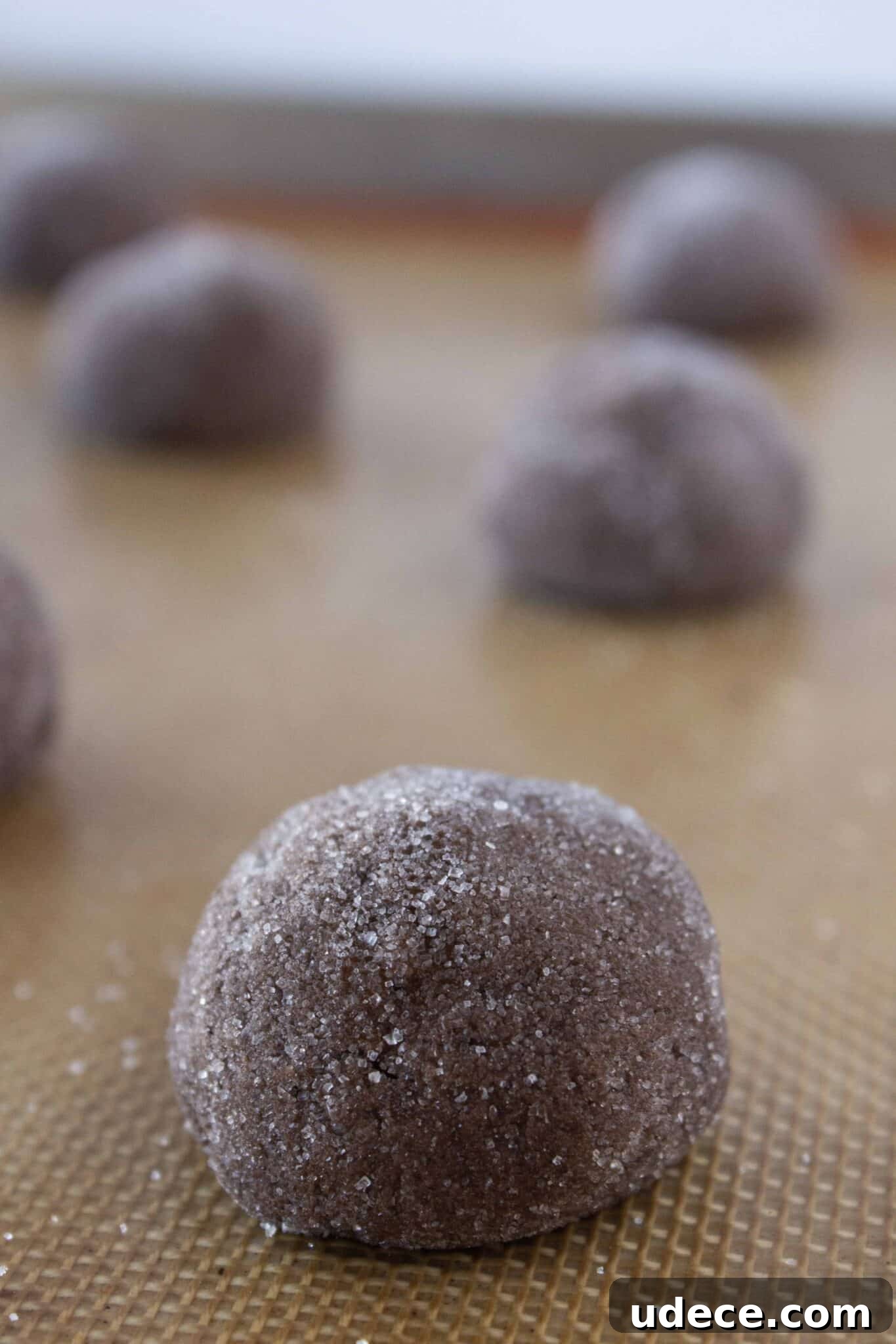 Chewy Chocolate Kiss Cookies Recipe: Classic Chocolate-Studded Cookies 5 Making the chocolate cookie dough and rolling the balls in granulated sugar.
