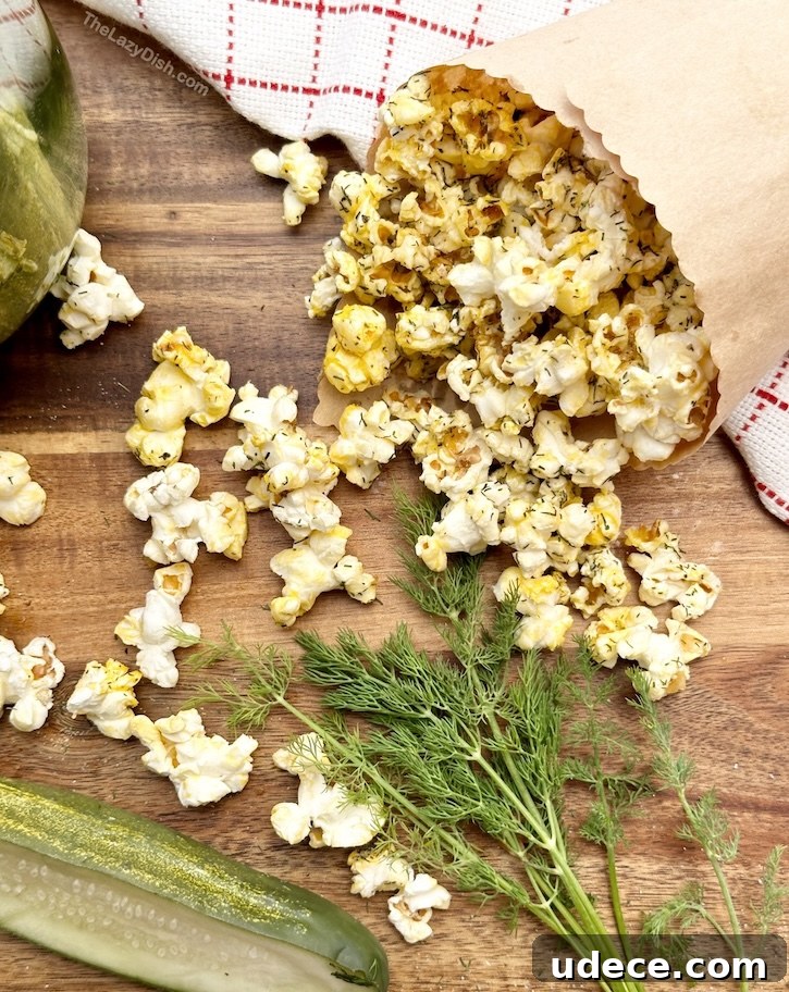 The best semi-homemade popcorn recipe ever! Turn regular microwave popcorn into dill pickle popcorn with just a few simple ingredients from your pantry! This delicious snack idea is so fun to make and very addicting! I could eat this flavored popcorn everyday.