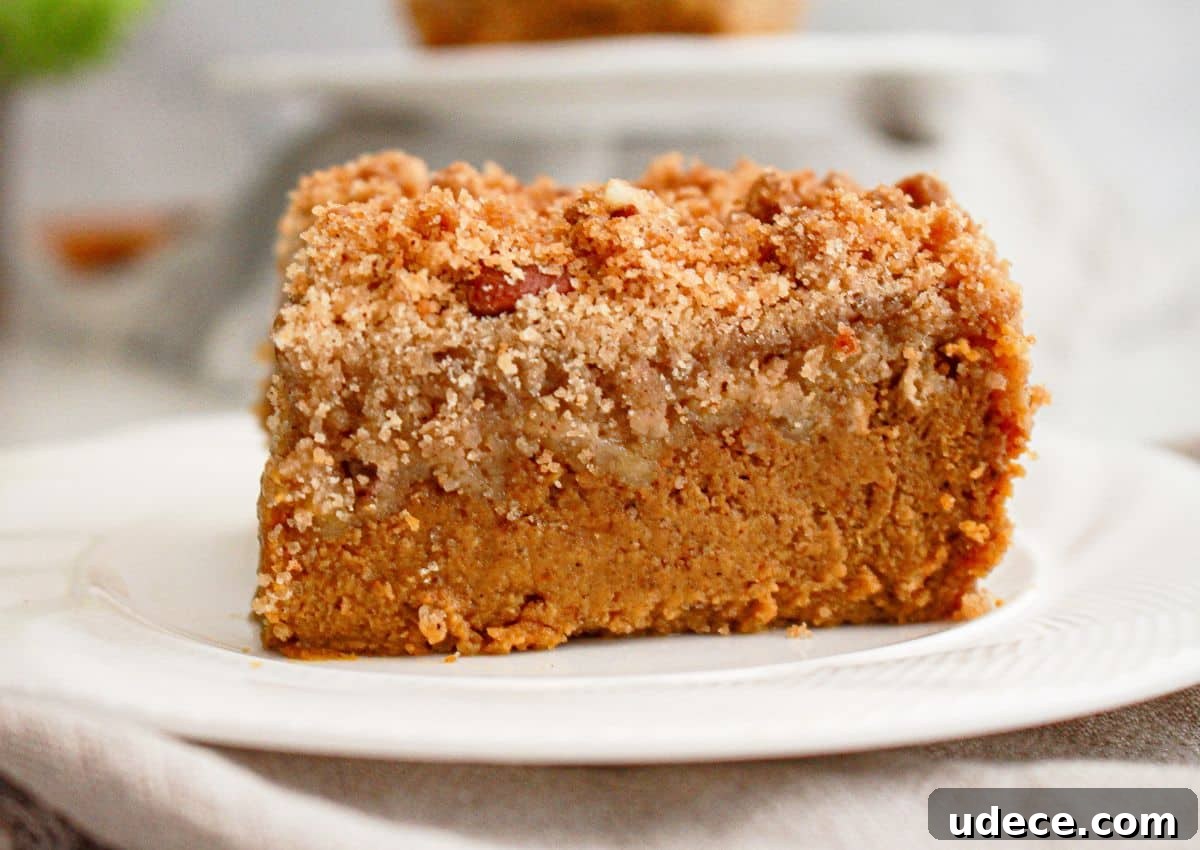 Slice of pumpkin pie crisp on a plate.