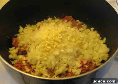 Spaghetti with Authentic Greek Meat Sauce (Makaronia me Kima) 3 Saute onions and beef for greek recipe makaronia me kima, greek spaghetti with meat sauce.