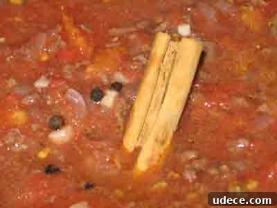 Spaghetti with Authentic Greek Meat Sauce (Makaronia me Kima) 9 Add tomato sauce and spices to greek recipe makaronia me kima, greek spaghetti with meat sauce.