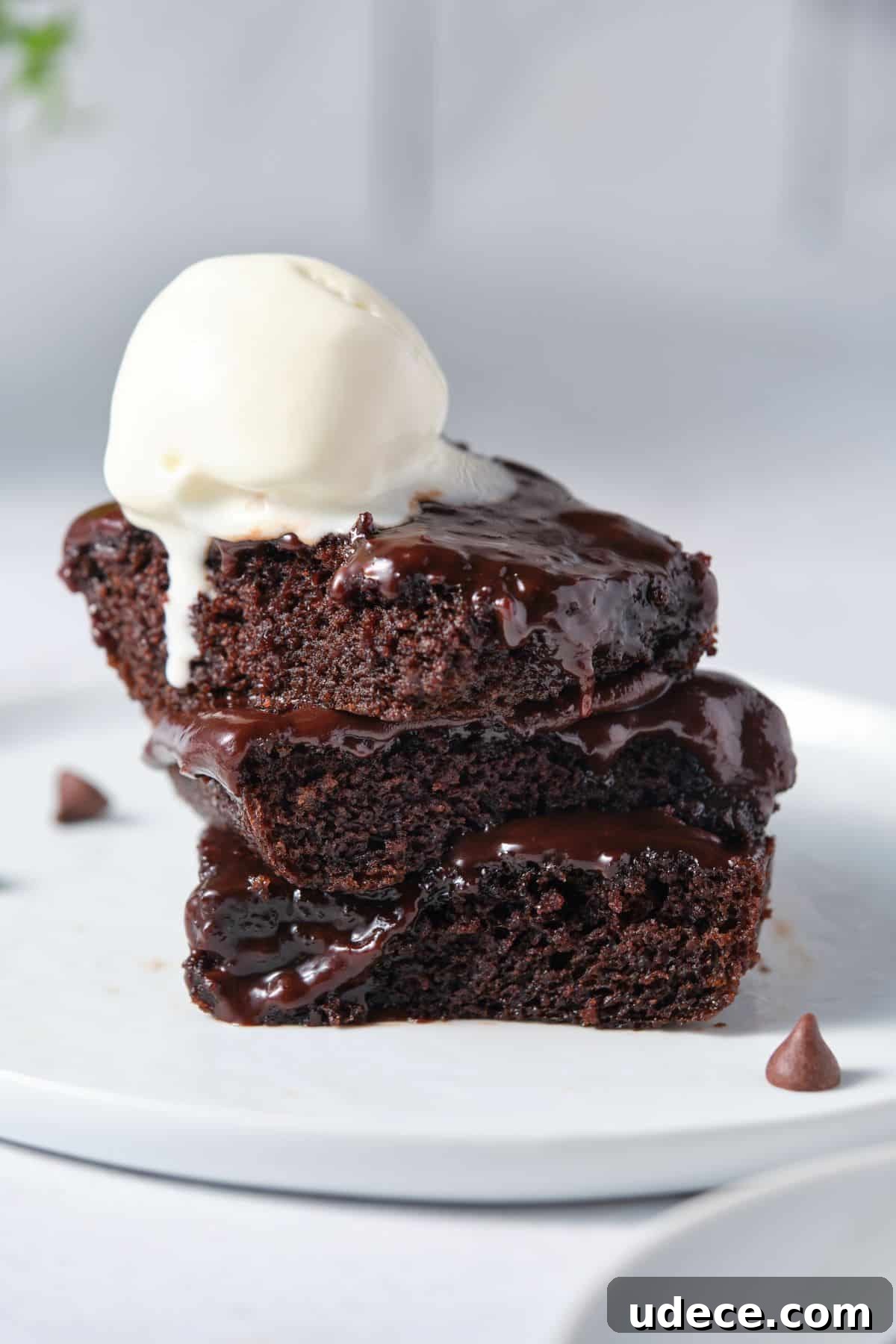 Moist Chocolate Fudge Cake Recipe You’ll Love 2 Moist chocolate fudge cake with melting vanilla ice cream on top.