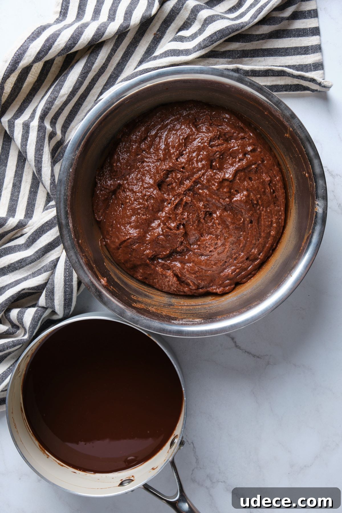 Moist Chocolate Fudge Cake Recipe You’ll Love 7 The chocolate fudge batter and the chocolate butter mixture in bowls.
