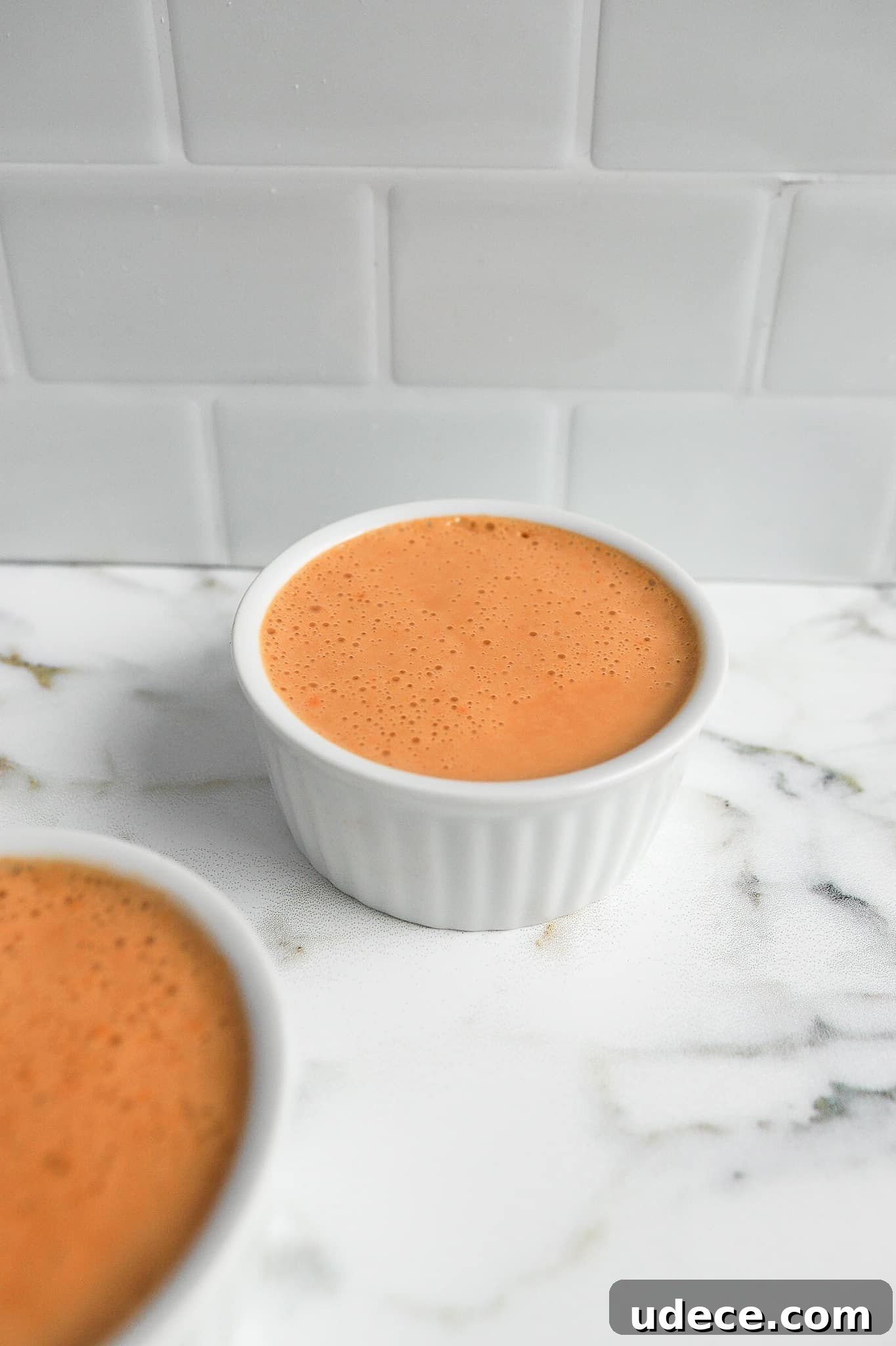 2-Ingredient Protein Pudding Without Greek Yogurt: Creamy Chocolate Recipe 3 high protein pudding recipe in two white ramekins
