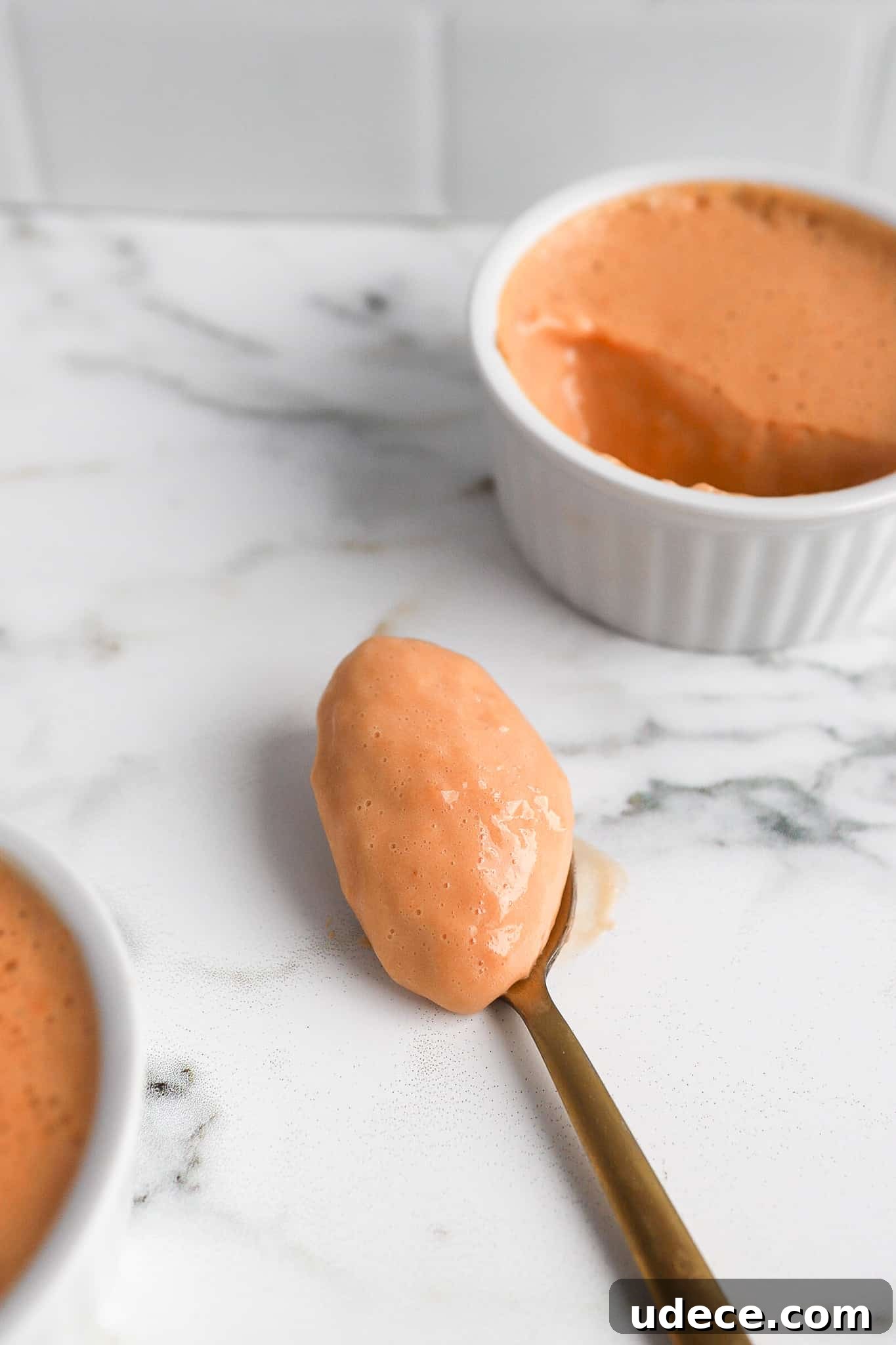 2-Ingredient Protein Pudding Without Greek Yogurt: Creamy Chocolate Recipe 6 close up shot of spoonful of high protein pudding on a gold spoon