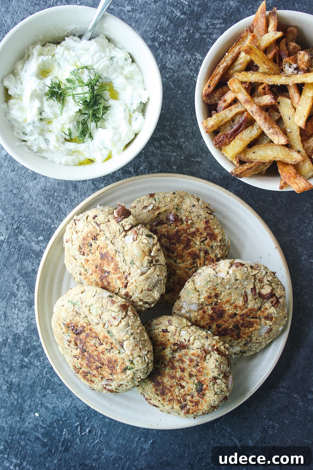 Hearty burgers with sweet potato, quinoa and kidney beans, topped with a light and creamy tzatziki