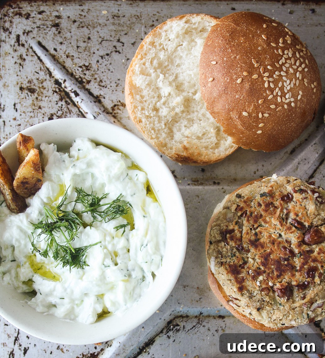 Hearty burgers with sweet potato, quinoa and kidney beans, topped with a light and creamy tzatziki