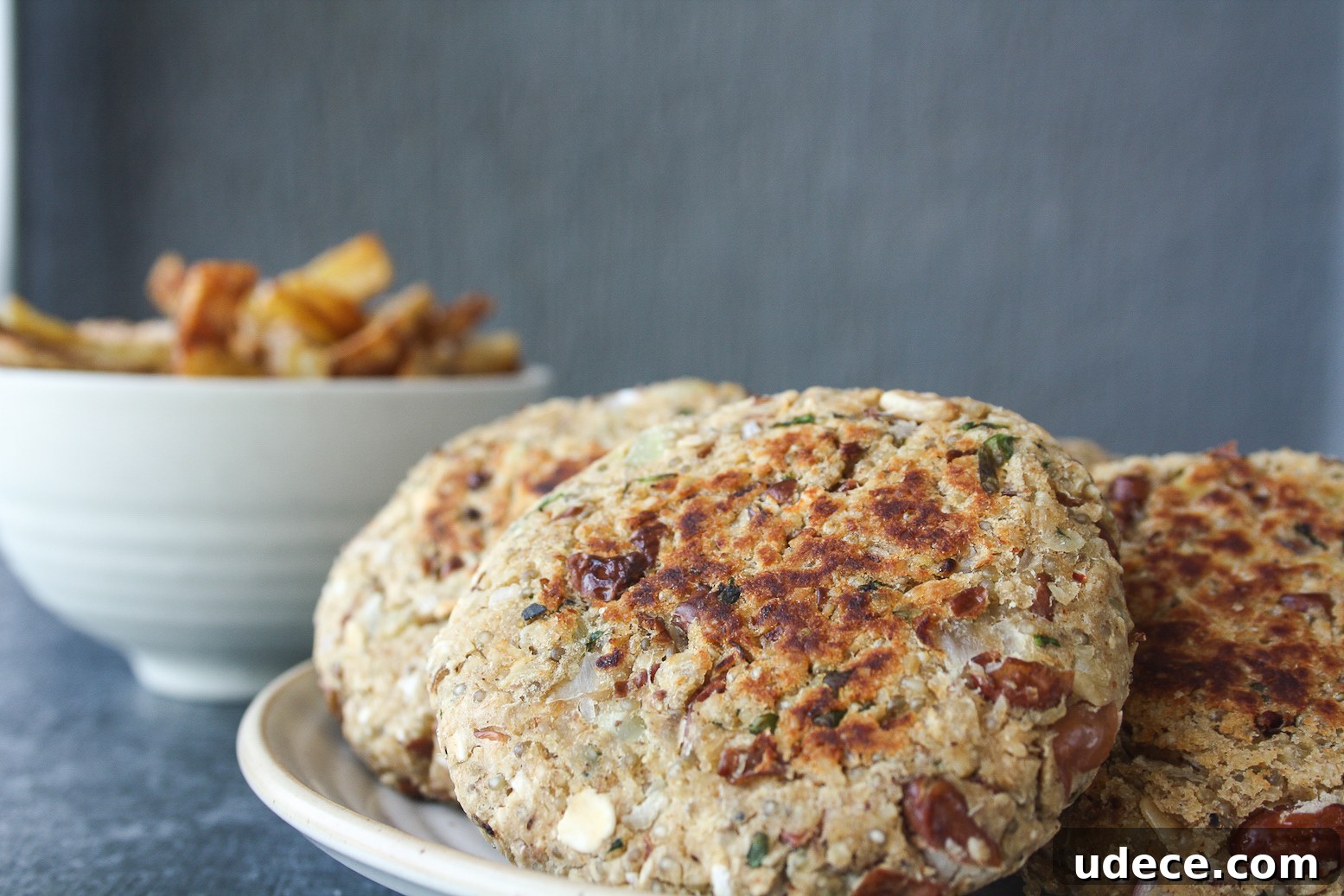 Hearty burgers with sweet potato, quinoa and kidney beans, topped with a light and creamy tzatziki