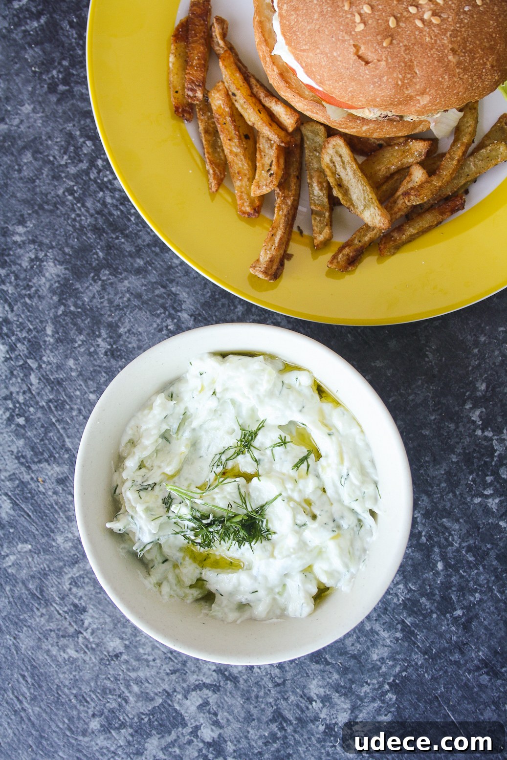 Hearty burgers with sweet potato, quinoa and kidney beans, topped with a light and creamy tzatziki