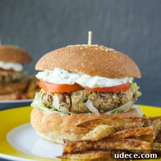 Hearty burgers with sweet potato, quinoa and kidney beans, topped with a light and creamy tzatziki